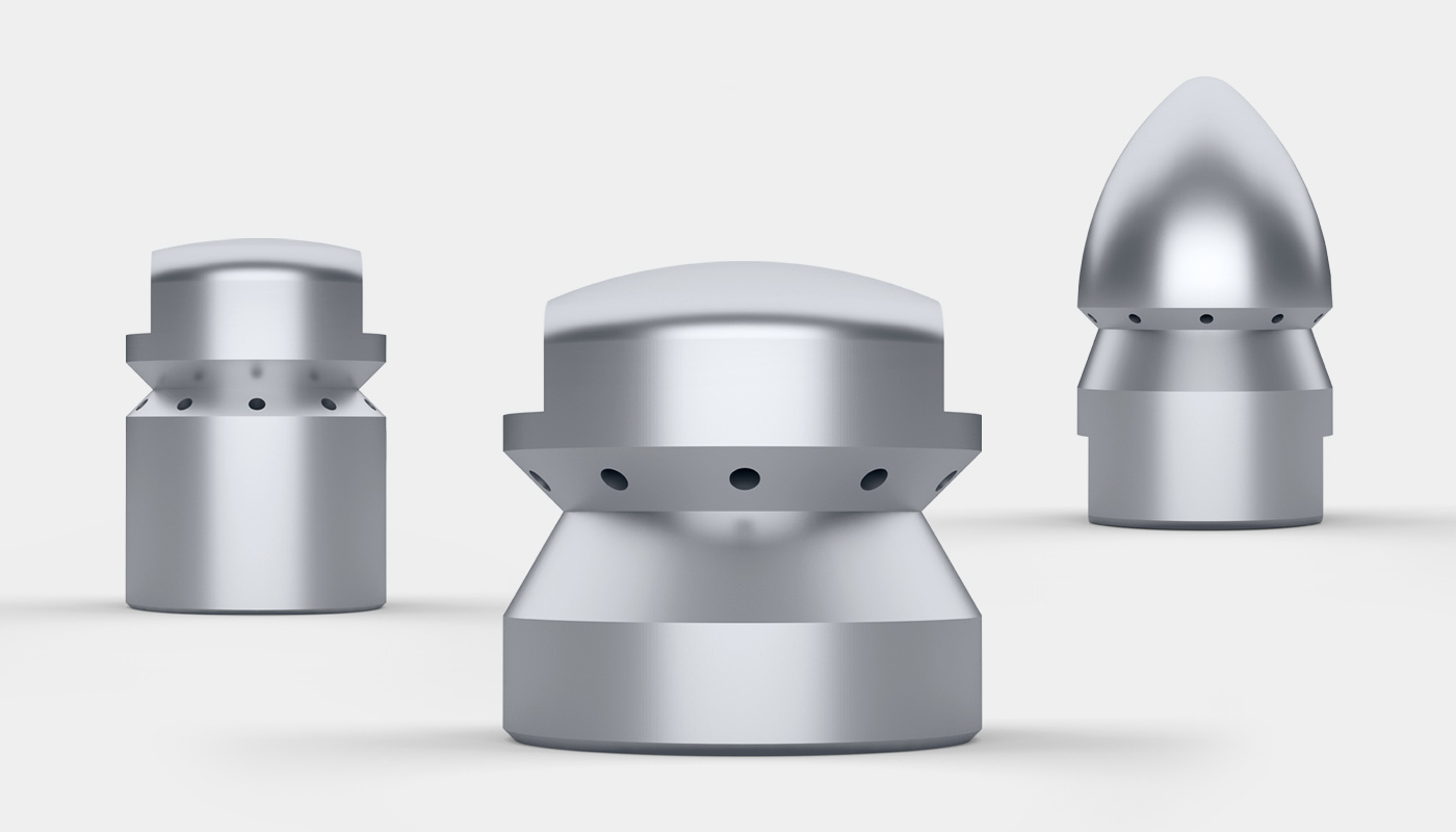 Three SCHMIDT EHS pipe cleaning nozzles slightly offset to each other. From left to right: EHS model 618 with the bore hole towards the front, EHS model 619 with the bore hole towards the front and EHS model 620 in conical design.